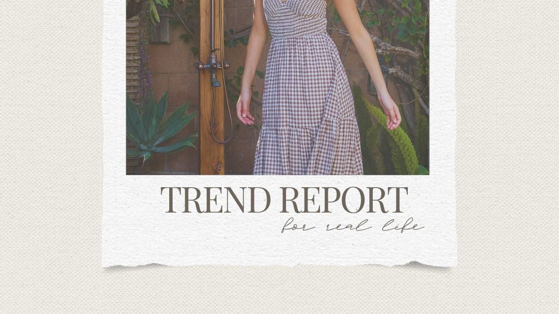 Woman wearing brown gingham smocked bodice maxi dress with gold hoop earrings and anklet — summer 2026 trend report from Wavy Boutique