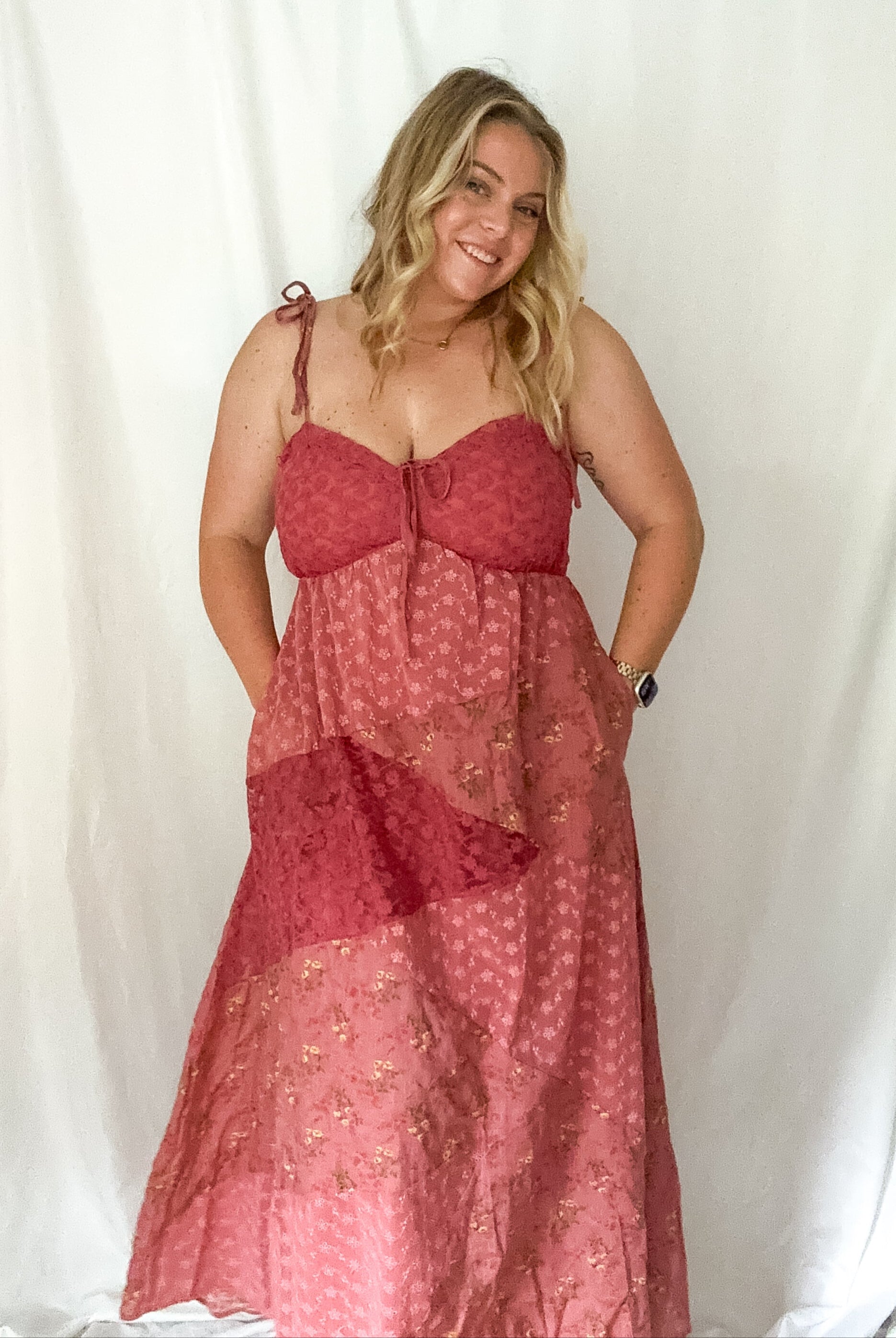 Woman wearing a red dress against a white background