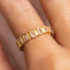 A gold-plated stainless steel ring with hypoallergenic cubic zirconia stones set on it.