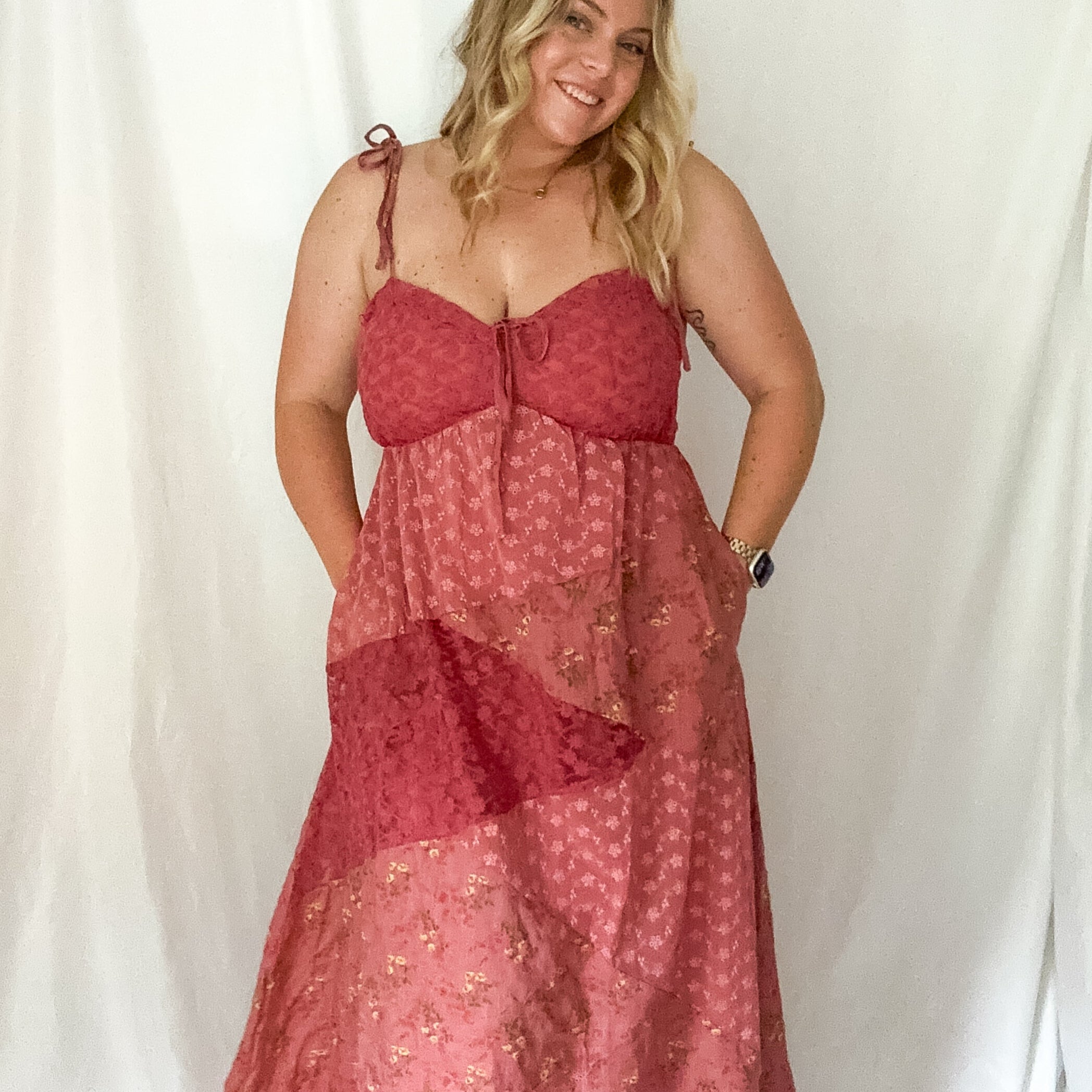 Woman wearing a red dress against a white background