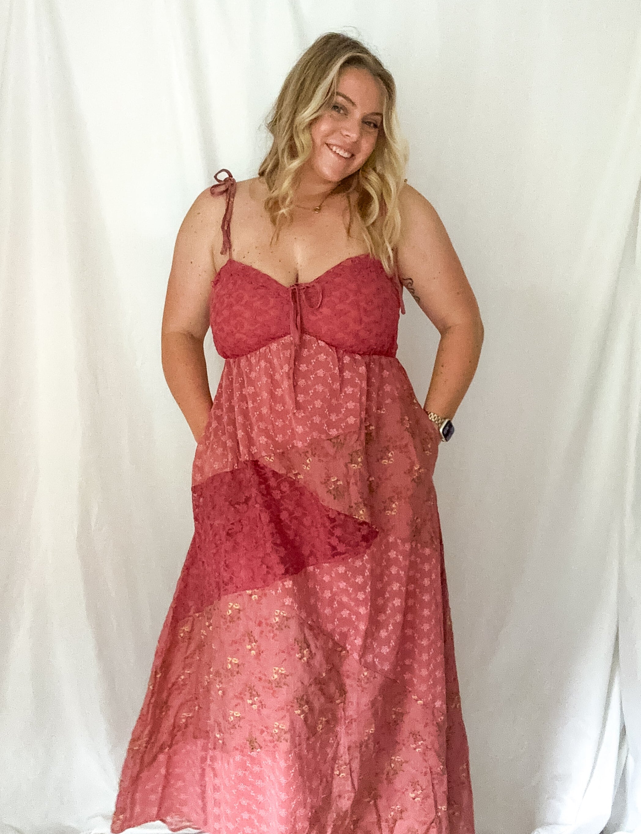 Woman wearing a red dress against a white background