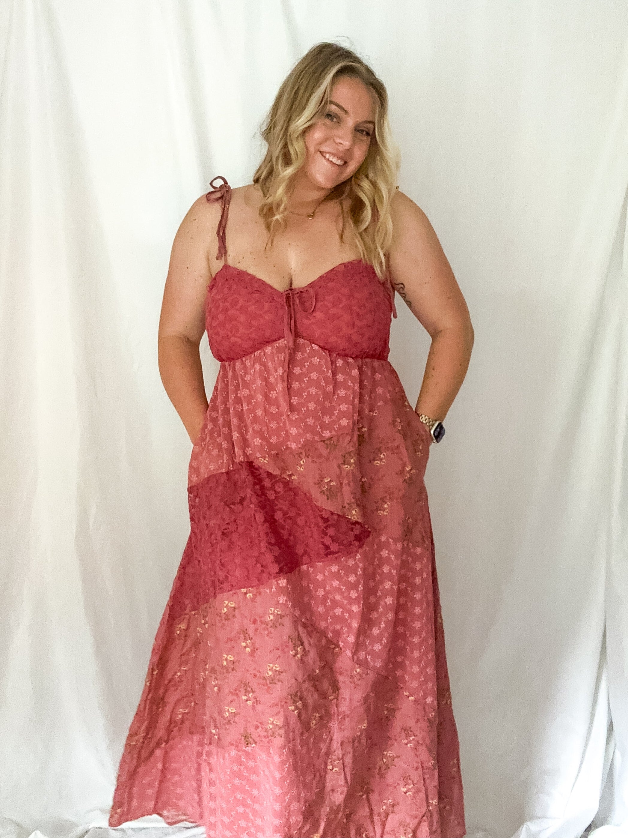Woman wearing a red dress against a white background