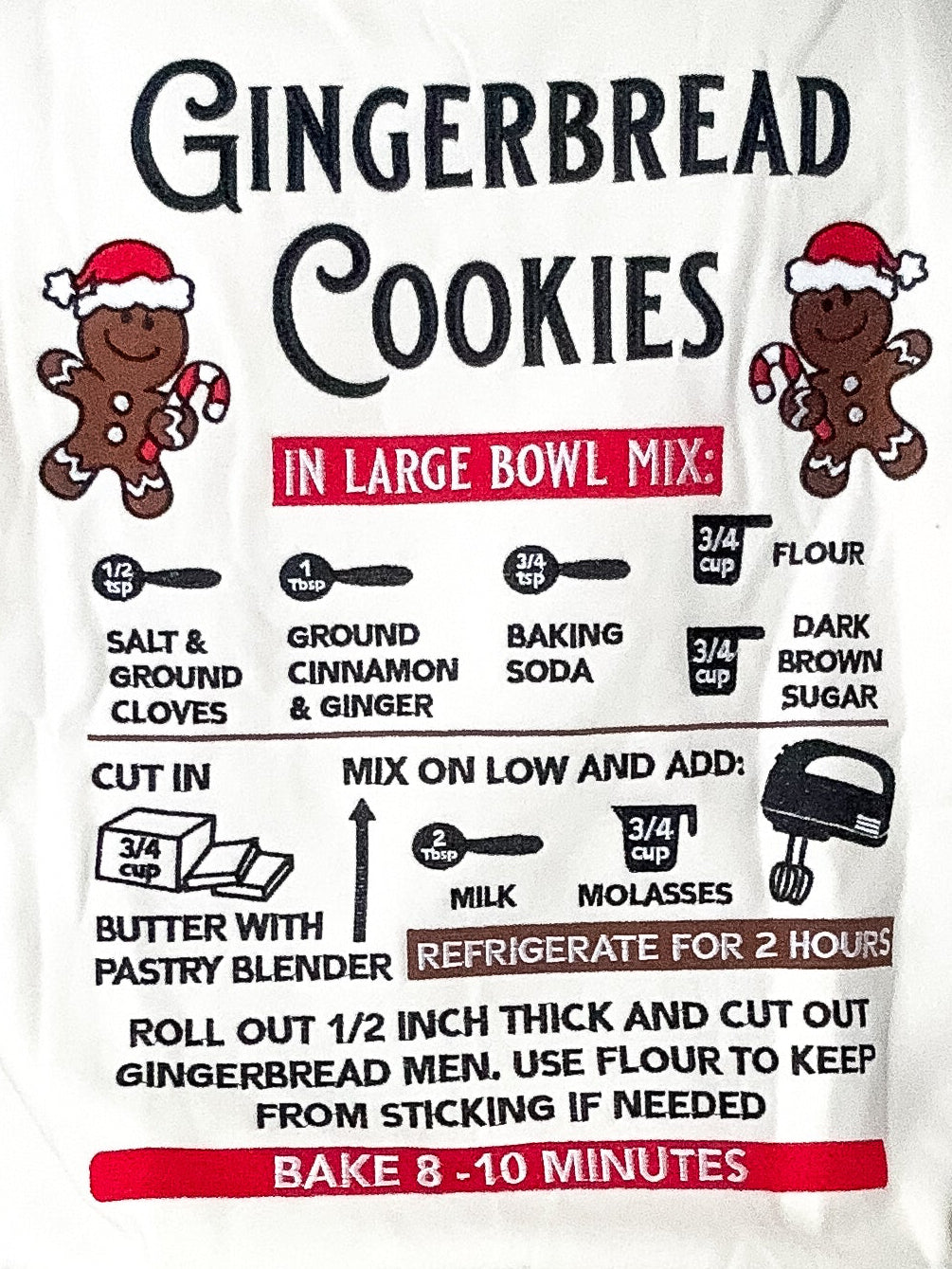 Person wearing a white sweatshirt with gingerbread cookies recipe design.