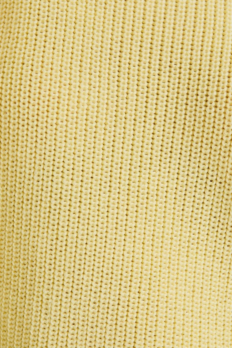 Close-up of a textured yellow fabric surface