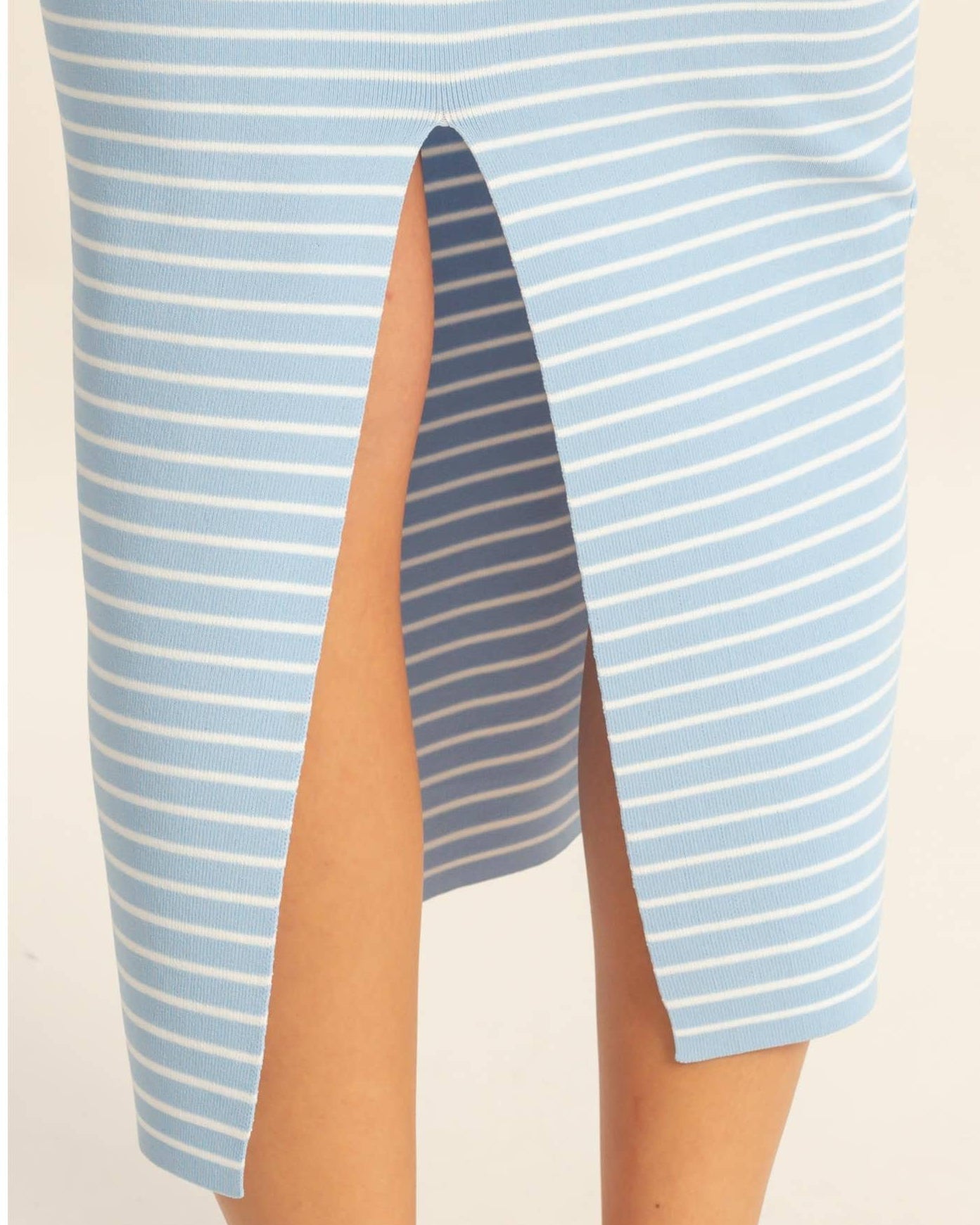 Blue and white striped dress with a slit on a plain background